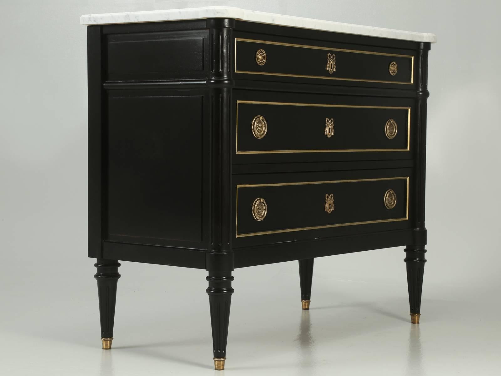 French Jansen inspired ebonized commode, or chest of drawers that was carefully restored by our Old Plank workshop. Although this French ebonized commode has the appearance of a 19th century piece, I believe it was probably made in the 1950s-1960s.