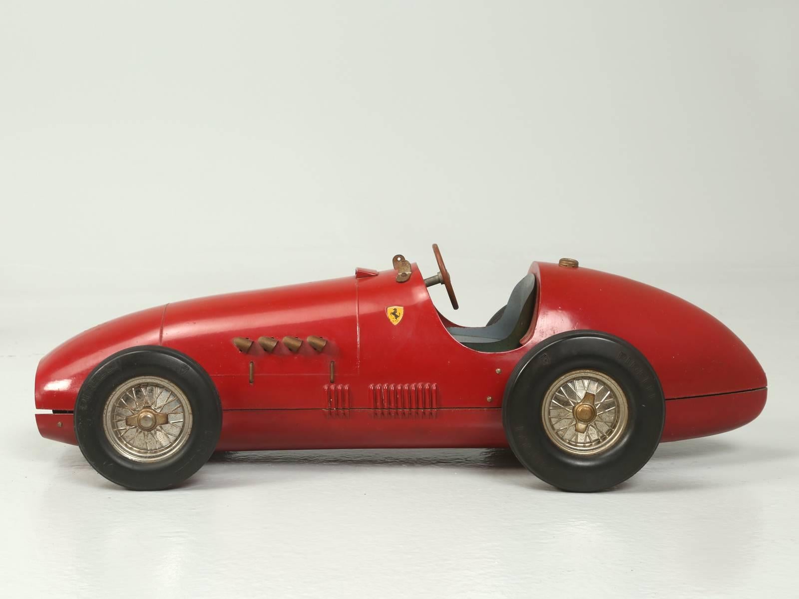 Rare and very desirable, steel-bodied, 1:16 scale Ferrari 500 F2, was produced in limited quantities by Marchesini, for the Italian distillery Toschi. The Ferrari originally held a bottle of Toschi cherries in liqueur and were presented to the race