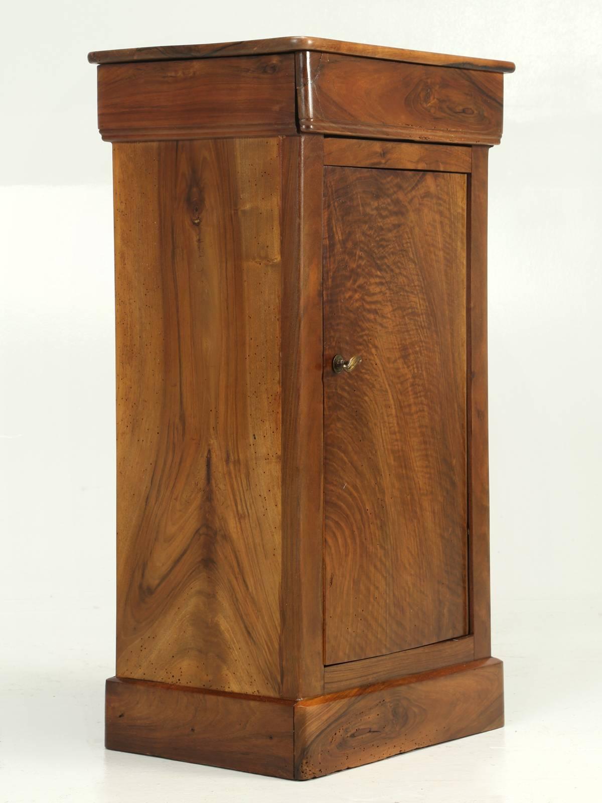 Antique French Louis Philippe style nightstand in a beautiful walnut that we just completed French polishing. Single drawer and door. This small night stand has exquisite graining in the walnut.