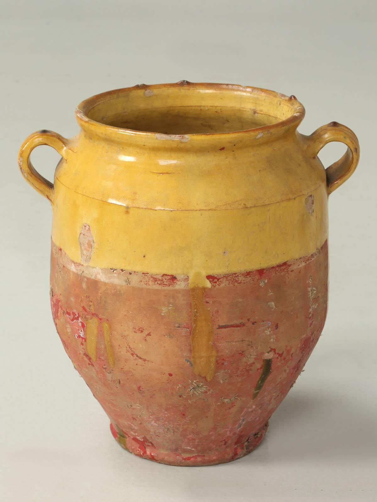 Antique French pottery confit pot and would be ideal for decorating a country inspired kitchen.
Please note, that there are two holes, one in the center and one on the bottom.