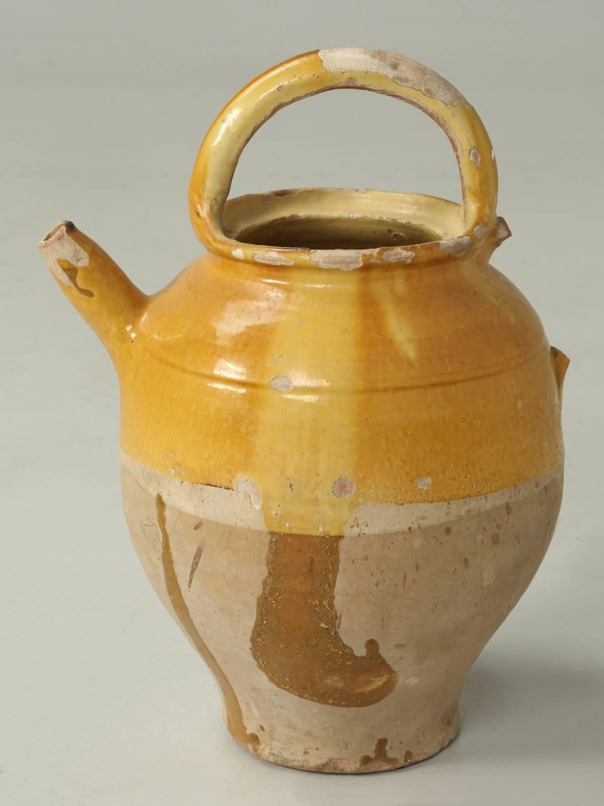 Original French Turn-of-the-century 19th c. Pottery Water Pitcher, or cruche, with top handle and pouring spout.  Commonly used for transporting and storing water. We have numerous pieces of French 19th c pottery, all in their original yellow