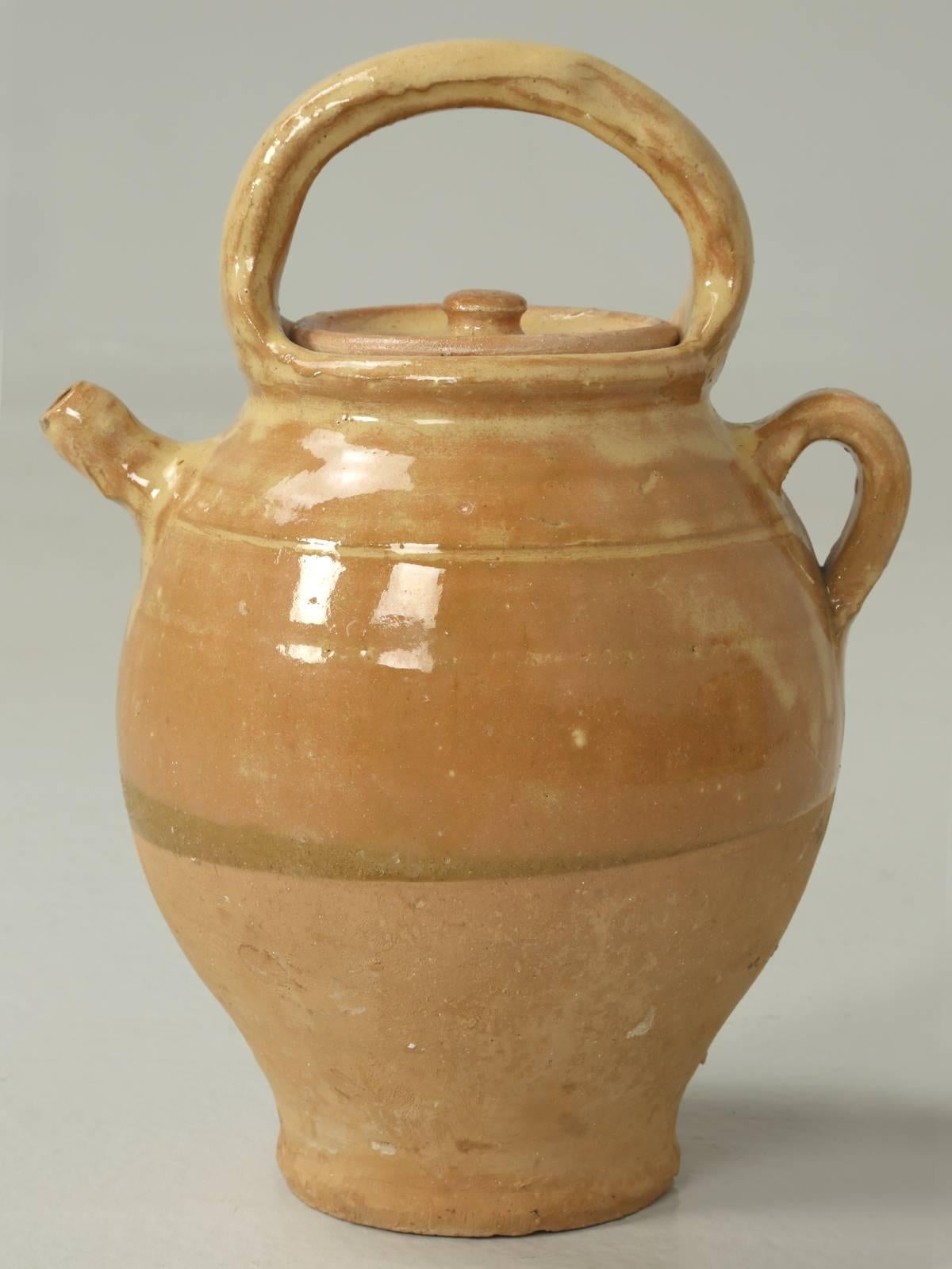 Antique French pottery jug with handle in a gorgeous rich ochre color. Have to say, that it is not very often that one shows up with a lid and although the color seems to match, I wonder if it was born that way great round handle, which would have