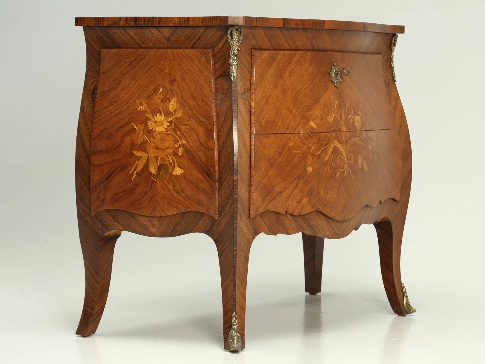 Vintage inlaid French Louis XV style commode, probably constructed during the 1930s or 1940s. What is nice about this particular French commode, is that the drawer construction quality, is really way above what we typically see. The backs of the