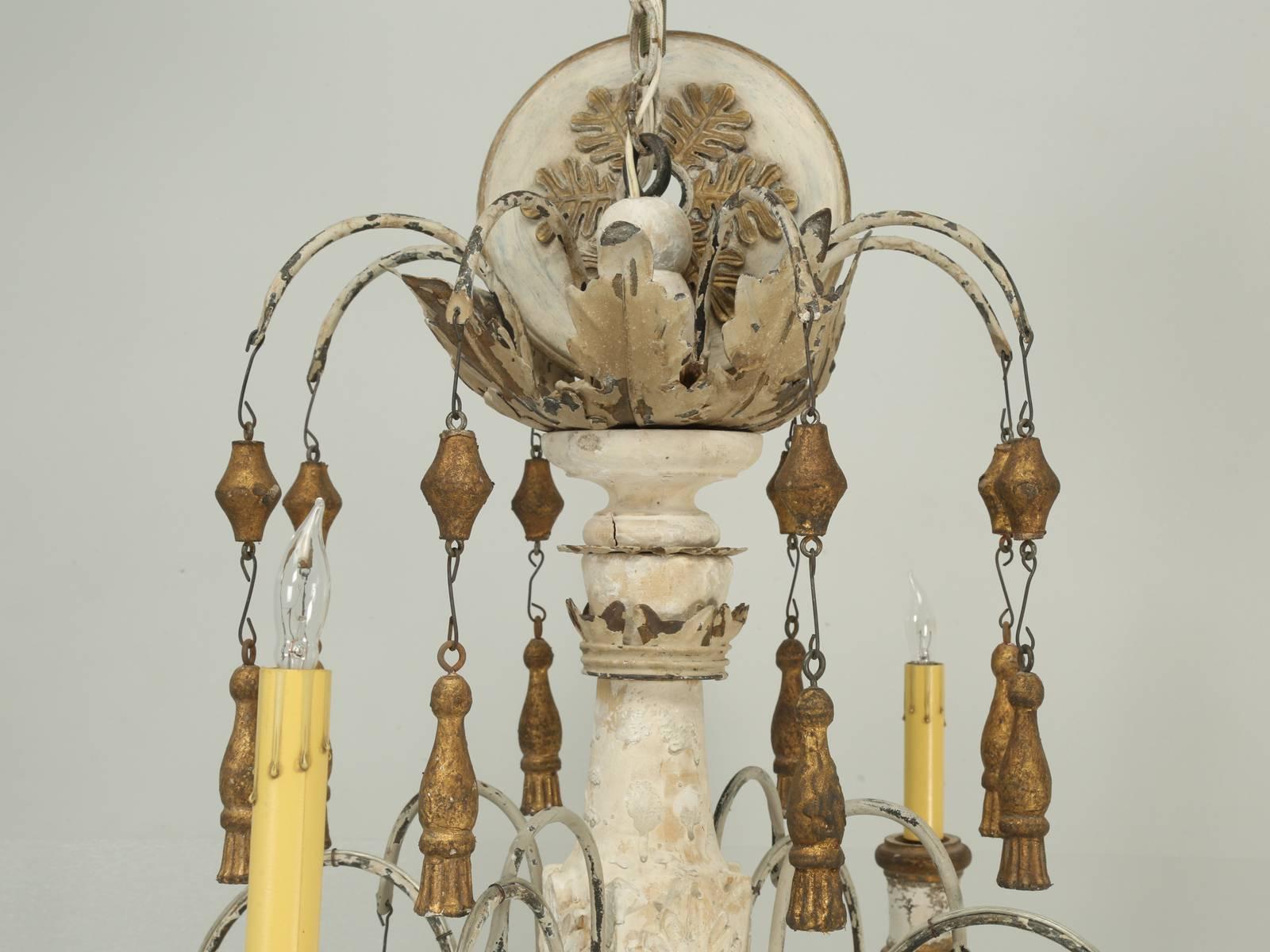 Huge Italian wooden chandelier and although when purchasing one of the Italian chandeliers in Europe, they will swear that they are antique, I prefer to think they are made from antique pieces or artifacts and assembled into a beautiful Italian