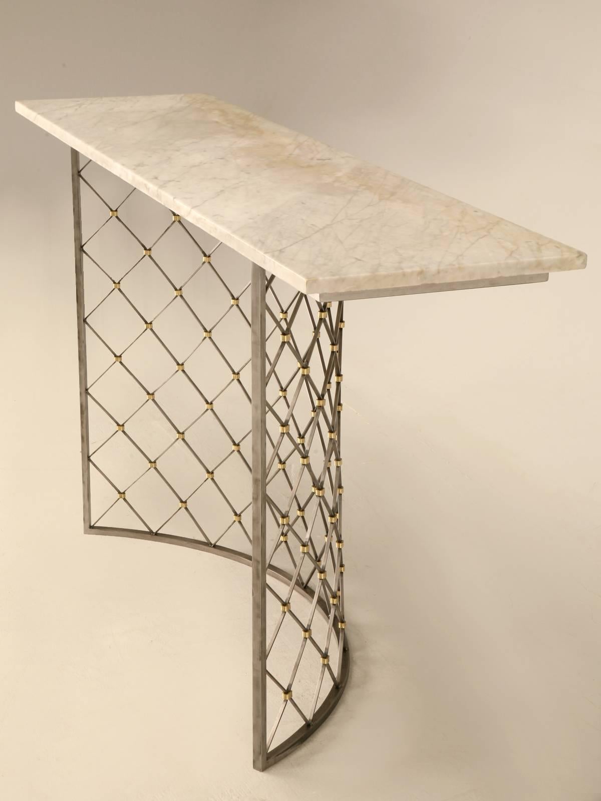 Mid-Century Modern style, coated steel cross-hatch console table has brass rings at each intersection creating a stunning design. This particular table was topped off with stone, but any material can be used for the top. We can reproduce this table