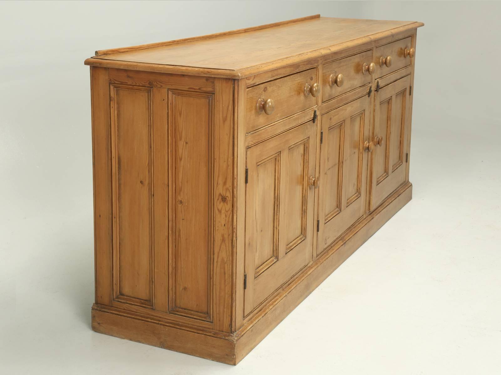 Country English antique pine buffet, or as the Brit’s would call it, a dresser or dresser base, since you did dress your food on it. This is a very original antique English pine buffet, that we actually came across in France, along with a matching