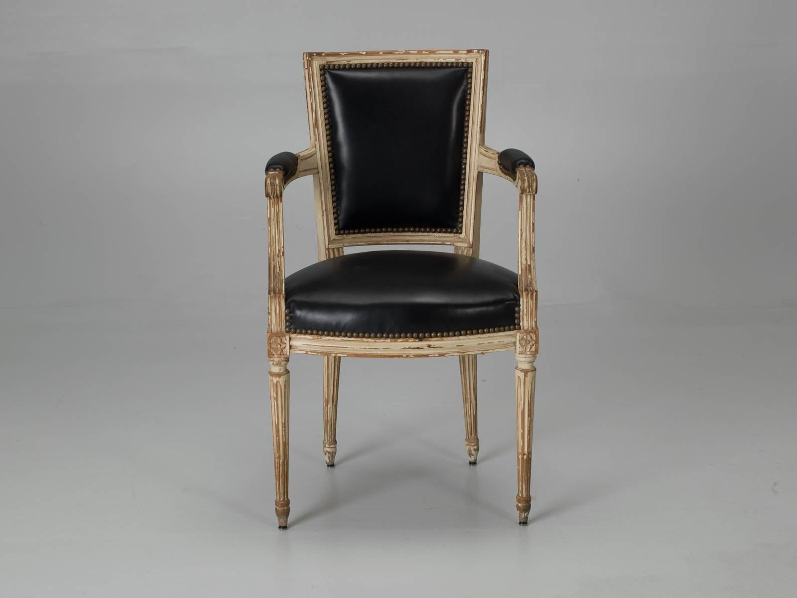 Set of six Louis XVI style dining chairs and very unusual to have a pair of matching armchairs. The paint on these Louis XVI style dining chairs, is 100% original and they have never been doctored, or as some call it, paint enhanced. Our Old Plank