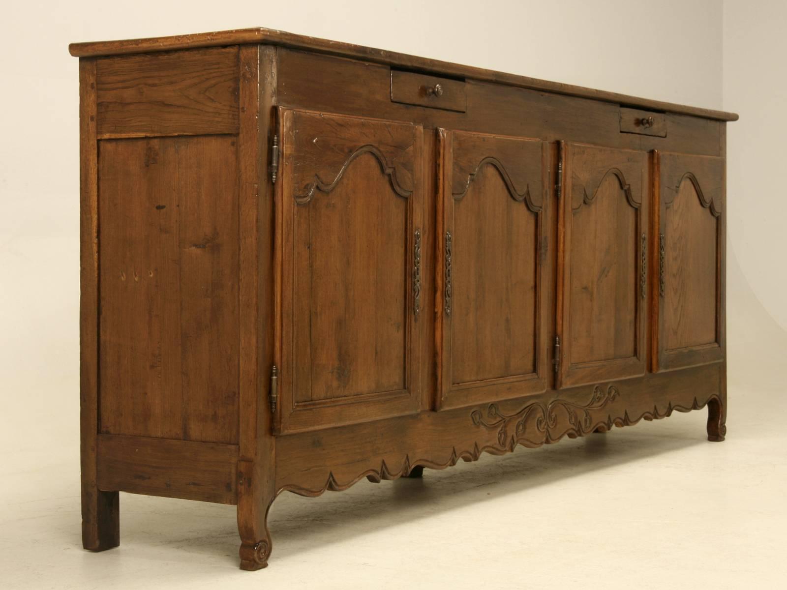 Antique Country French buffet from the late 1700’s and was located just outside of Toulouse, France. What makes this particular antique French buffet so is, is the shallow depth of the buffet, especially when one considers how long it is? Our
