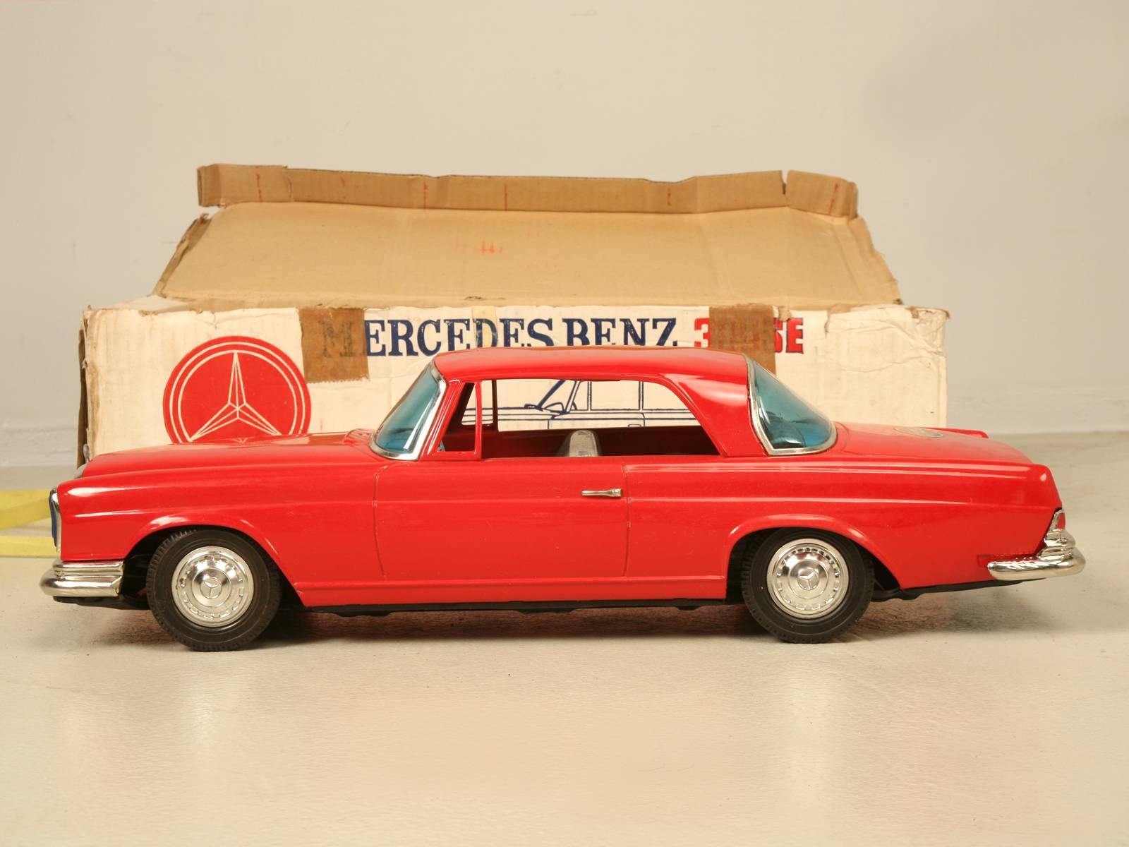 Mid-1960s huge Ichiko Mercedes-Benz 300SE coupe made in Japan with its original box, which to serious collectors is worth about the same as the car. This particular toy appears to have never been played with and remains in virtually NOS (new old