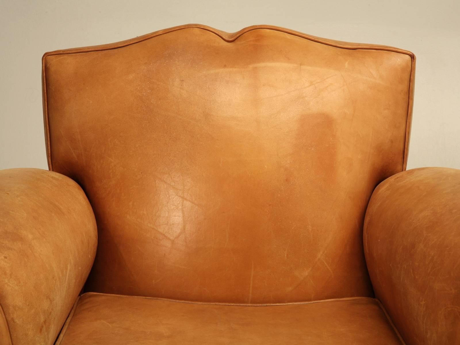 French leather mustache back club chairs in completely all original condition and requiring no restoration. Probably made after WWII and have seen very little use, which explains why they remained so nice.