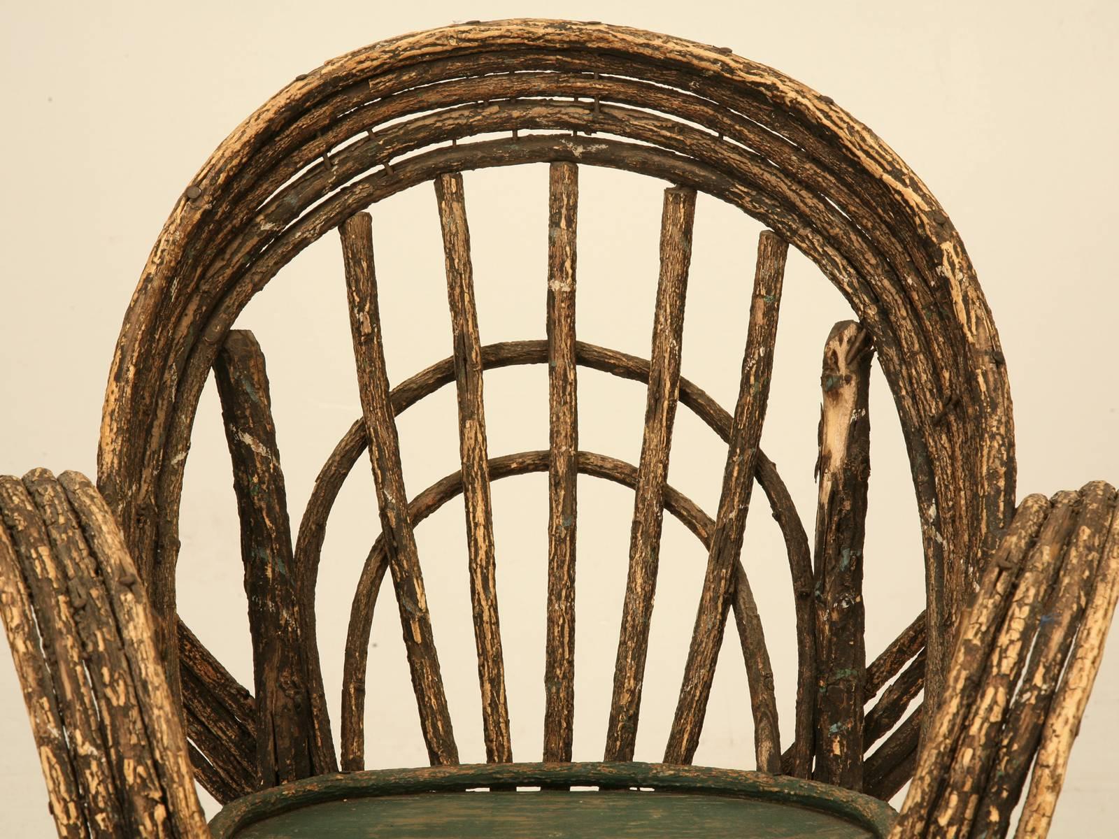 The only real antique bent willow original paint child’s rocking chair I have ever seen, let alone in such nice original unrestored condition. The perfect child’s room decorative accessory. 
Seat height is 8