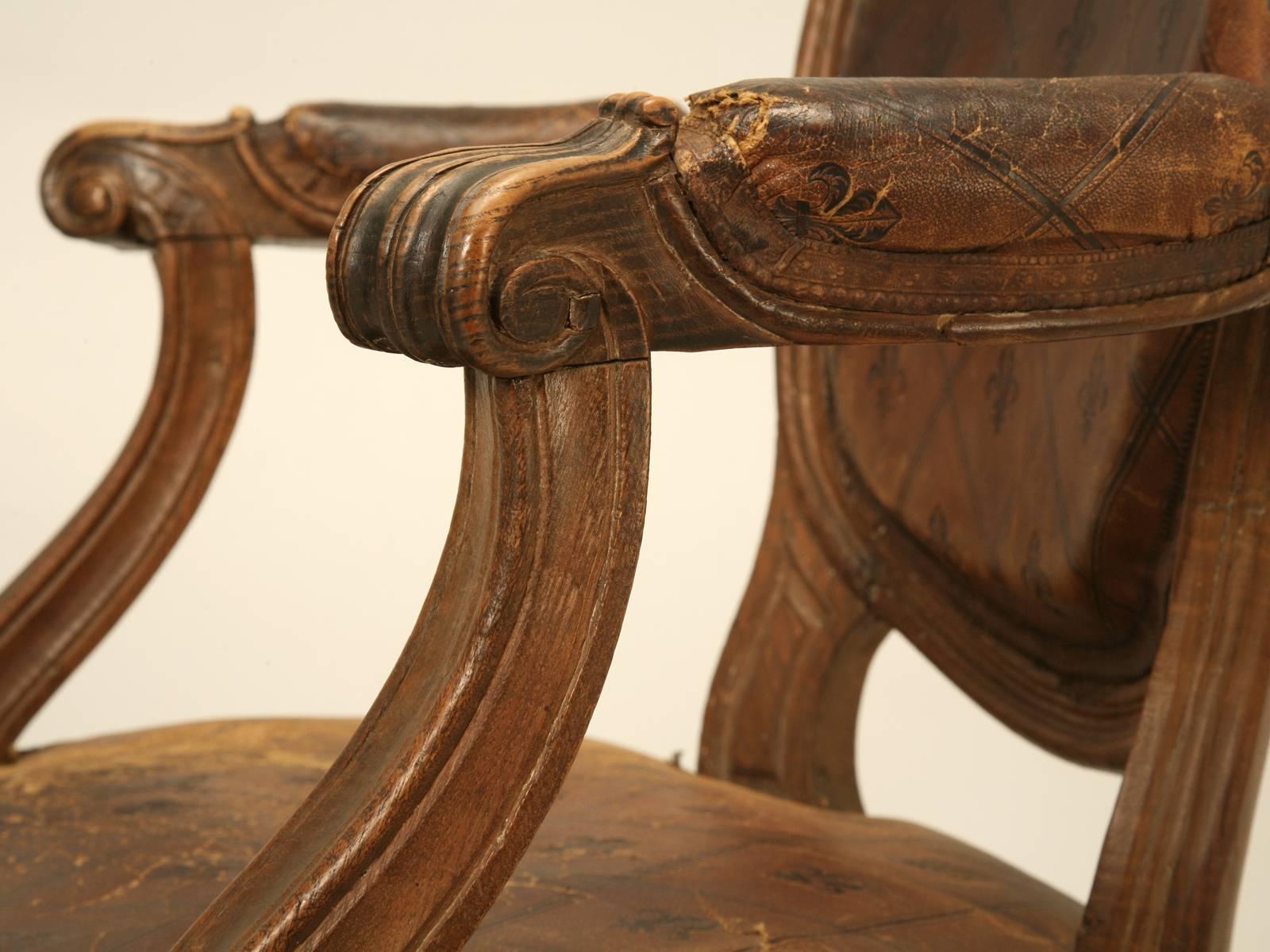 Late 19th Century French Louis XVI Style Armchairs in Original Leather with Unusual Fleur de Lis For Sale