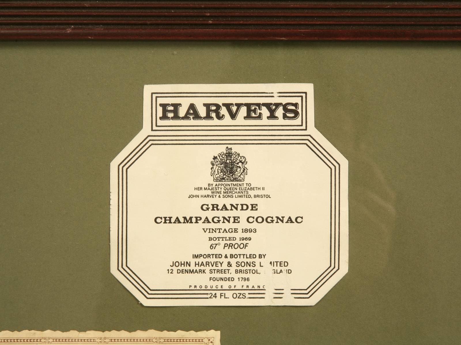 Framed collection of labels that would look great in a wine cellar.