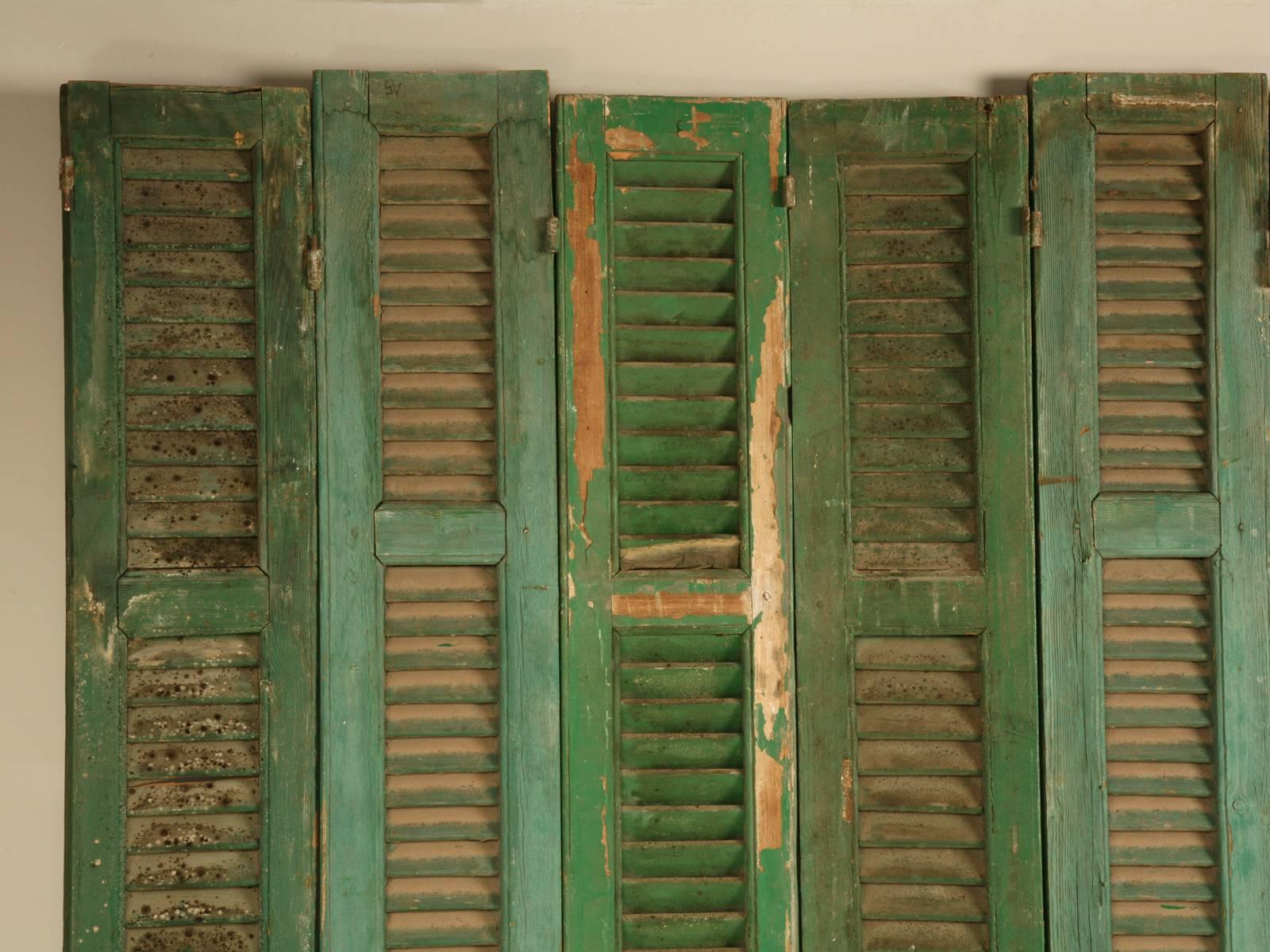 Found in Brittany and removed from a French chateau many years ago, this set of eight green shutters could be used for a myriad of different applications. From a simple room divider to a headboard there are endless possibilities. We have others