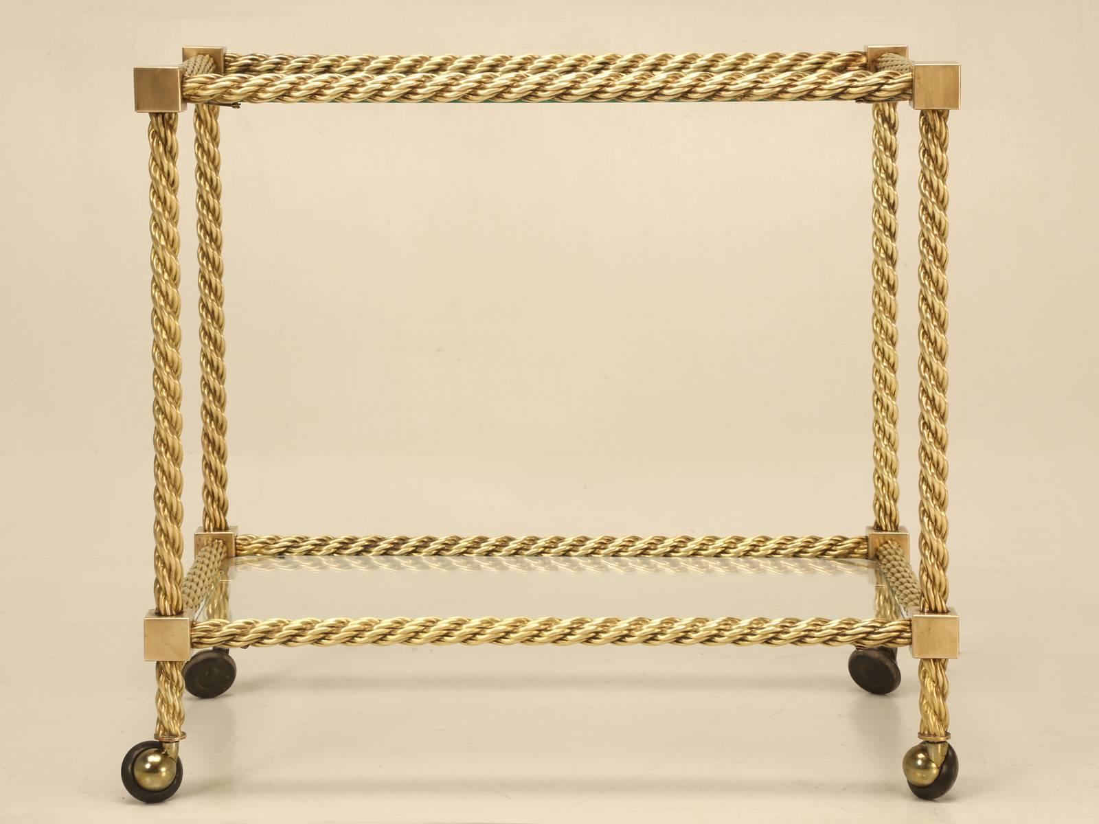 Vintage Mid-Century Modern French brass rope designed bar cart, probably made in the mid-1960s. Certainly not flawless, but in very nice original condition, with no prior repairs made or required.