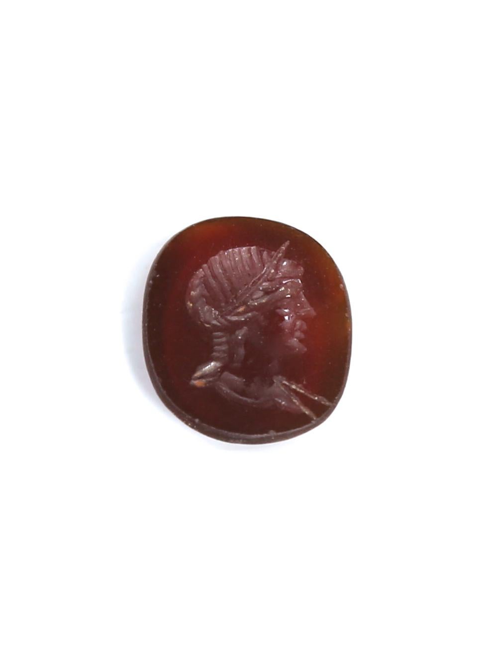 Ancient Roman Carnelian Intaglio. An intaglio is defined as a small Gemstone, generally semi-precious, that has been carved with images or inscriptions only on the face. This style of carving is the opposite of the cameo technique. The engraving of