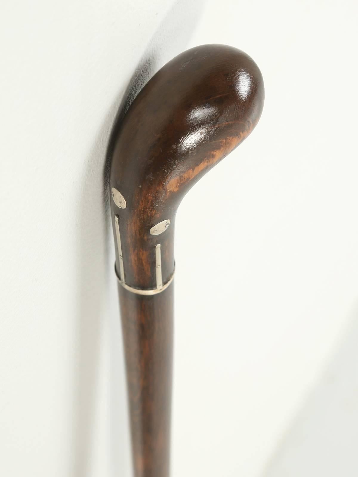 Antique French walking stick or cane, with beautiful silver inlays. Our old plank finishing department, refinished the wood shaft and polished the silver inlays and present a nice contrast between the dark wood and the silver. No prior repairs.