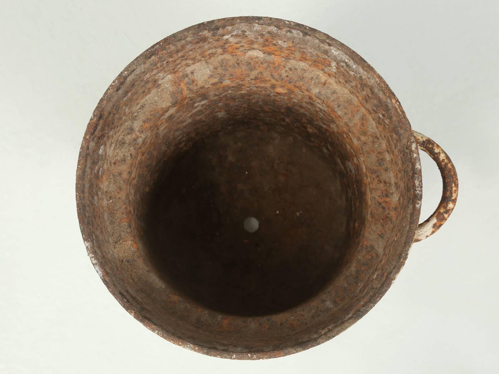 Very heavy cast iron footed planter, that we found in England. Please note it is missing one of its handles.