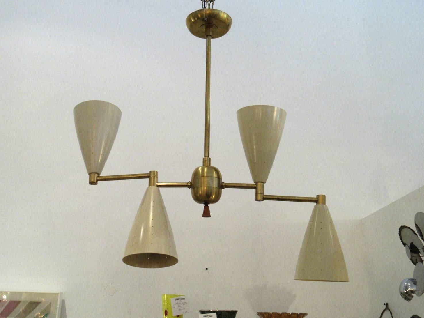 Two individually priced Mid-Century Modern brass and enamel light fixtures. The conical shades have articulating arms.