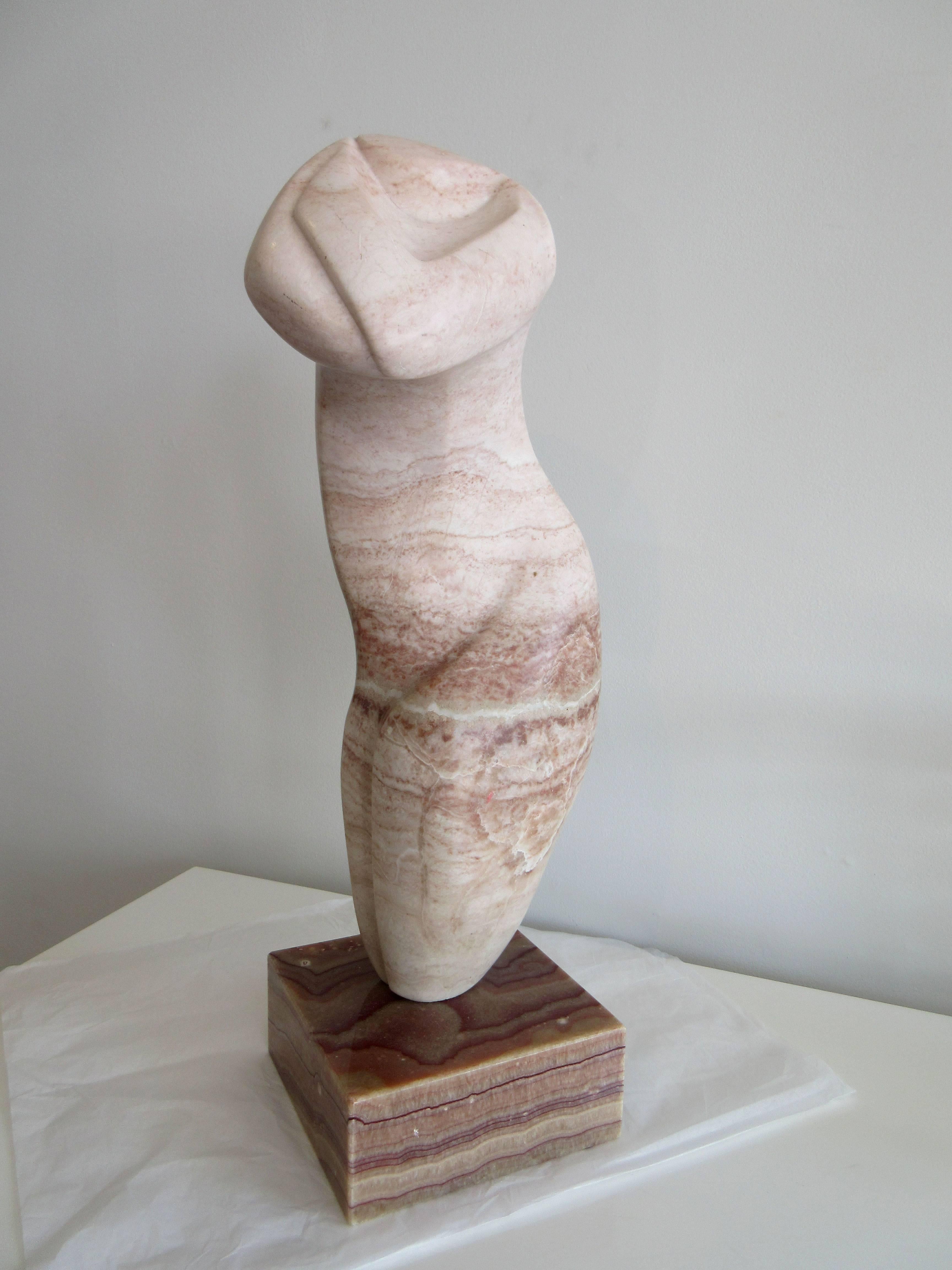 Biomorphic marble sculpture of a caressing figure, illegibly signed.