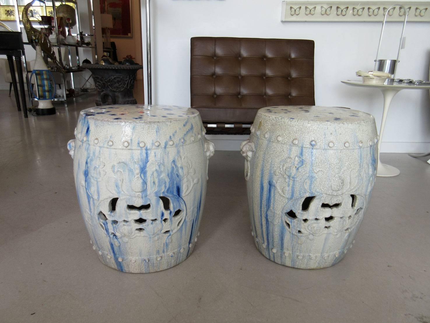 Pair of blue and white Chinese ceramic garden seats with blue glaze painting or tie-dye effect and fine surface craquelure.