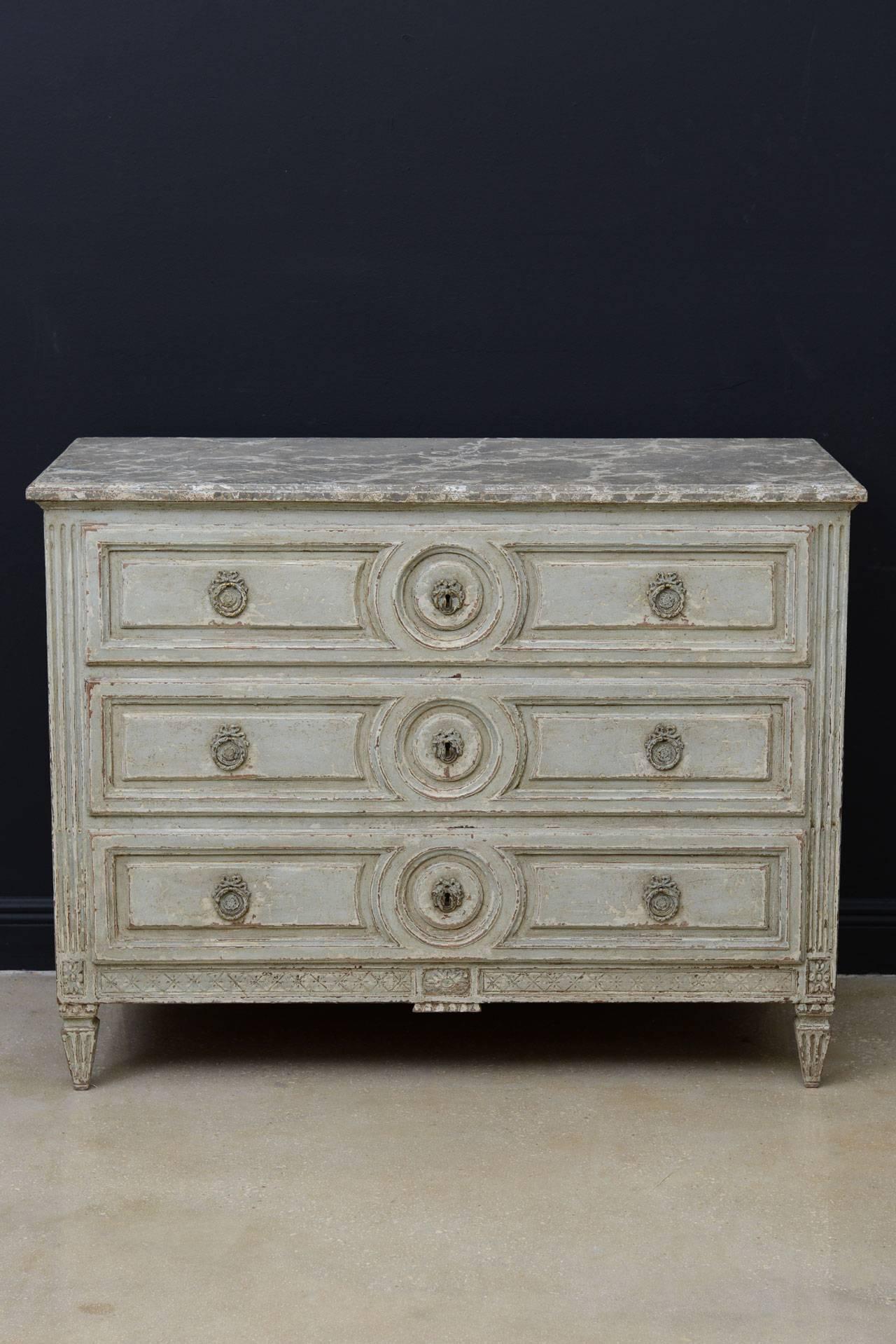 French Louis XVI style painted chest of drawers with faux marble top and three pull-out drawers.