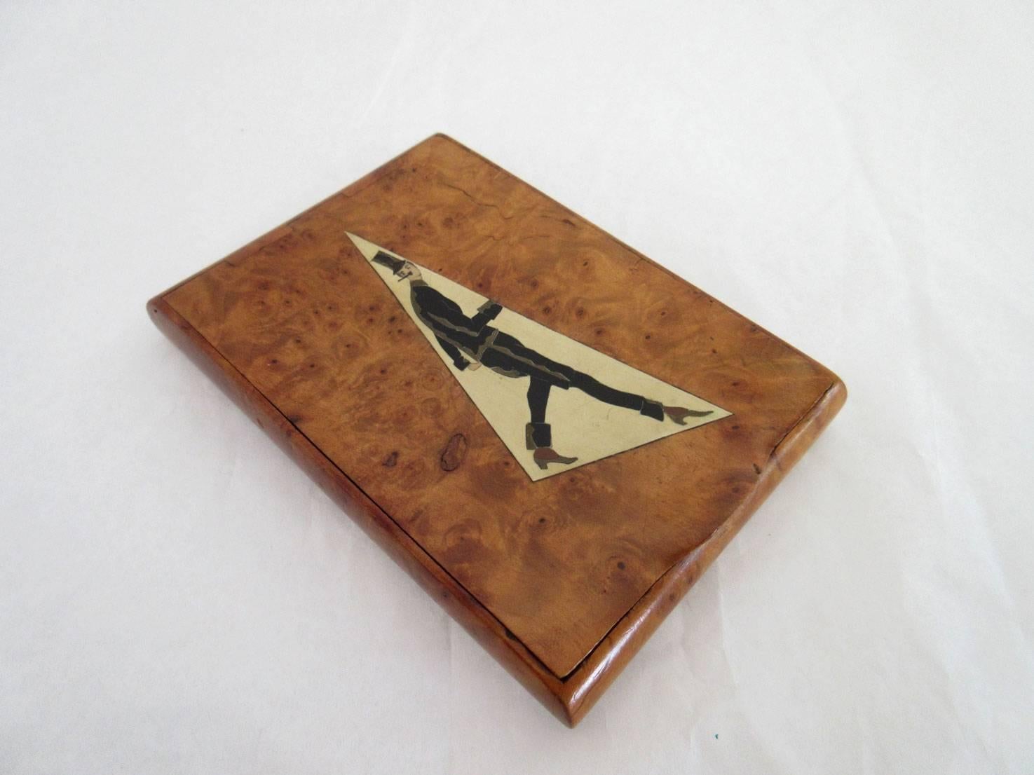 Art Deco French burl wood cigarette case with gentleman in a top hat as cover motif.