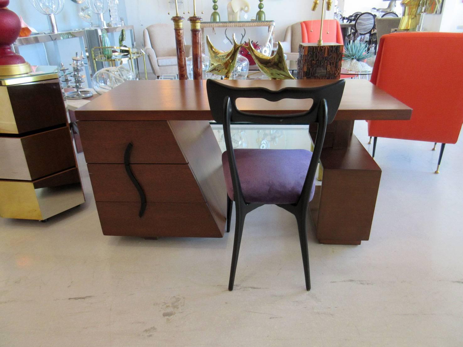 Dark wood Mid-Century desk by Maximillian for Karpen Furniture, a manufacturer from Los Angeles.