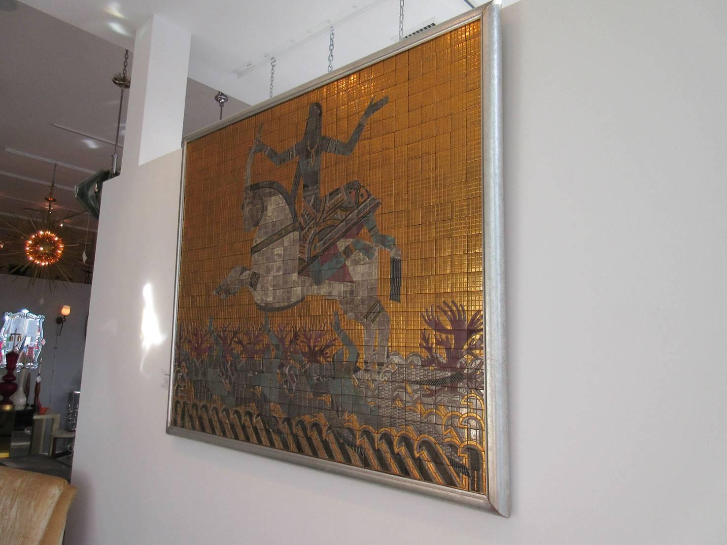 Mosaic wall applique featuring figural tableau by Russian Artist Valentin Shabaeff (1891-1977). This piece was created in 1930s. The imagery is Egyptian Revival with gold mosaic background and central figure of warrior on horseback.