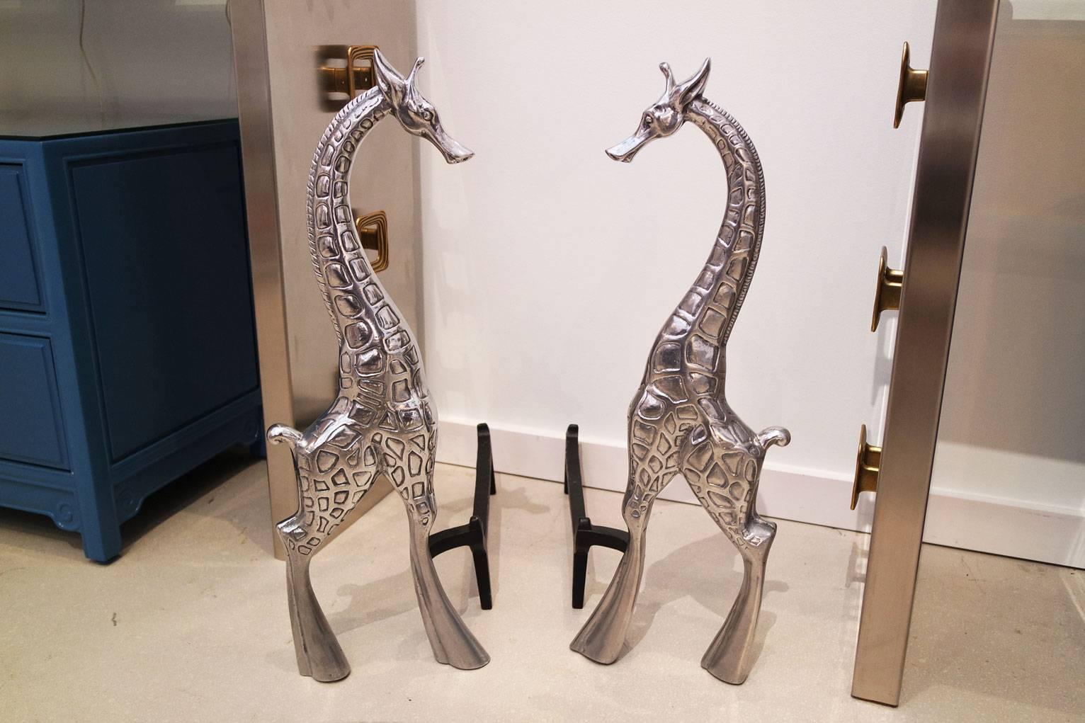 Pair of aluminium Arthur Court giraffe andirons.
Measures: 26.5" H x 9.25" W x 18.25" D.