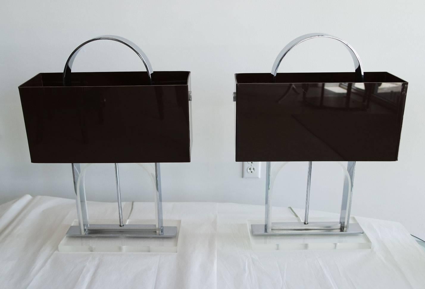 Pair of clear Lucite and nickel lamps with dark brown Lucite shades in the style of Pierre Cardin.

Base measurements: 13