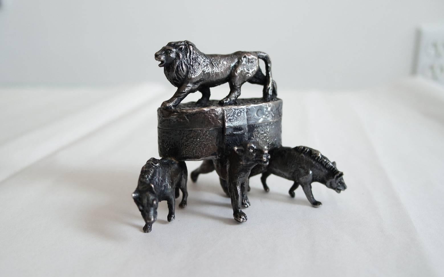 Handmade box with sculpted wild cats. The box was made in the 1970s.