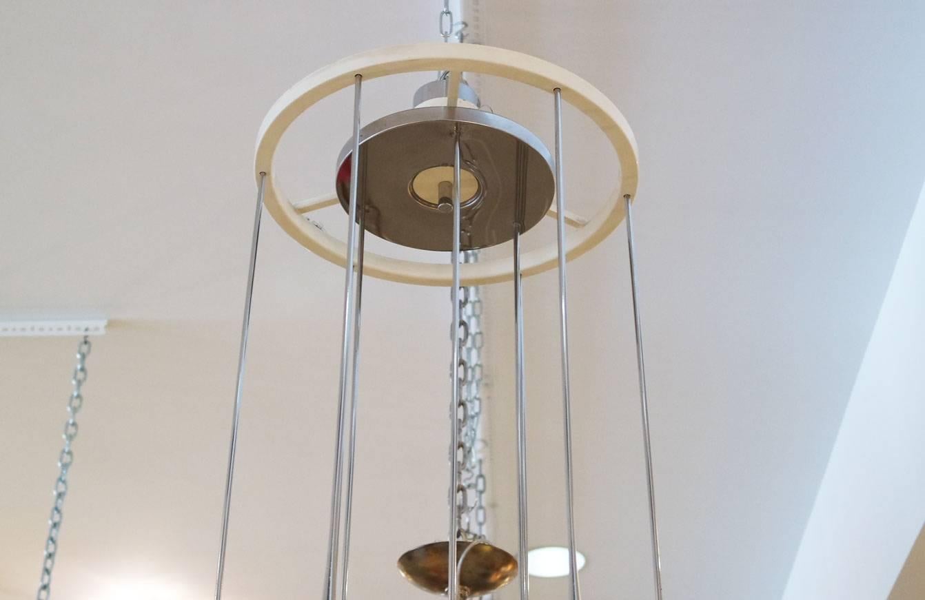 Signed Mid-Century Modern Esperia chandelier with chrome cascading arms. There are nine sockets in total.