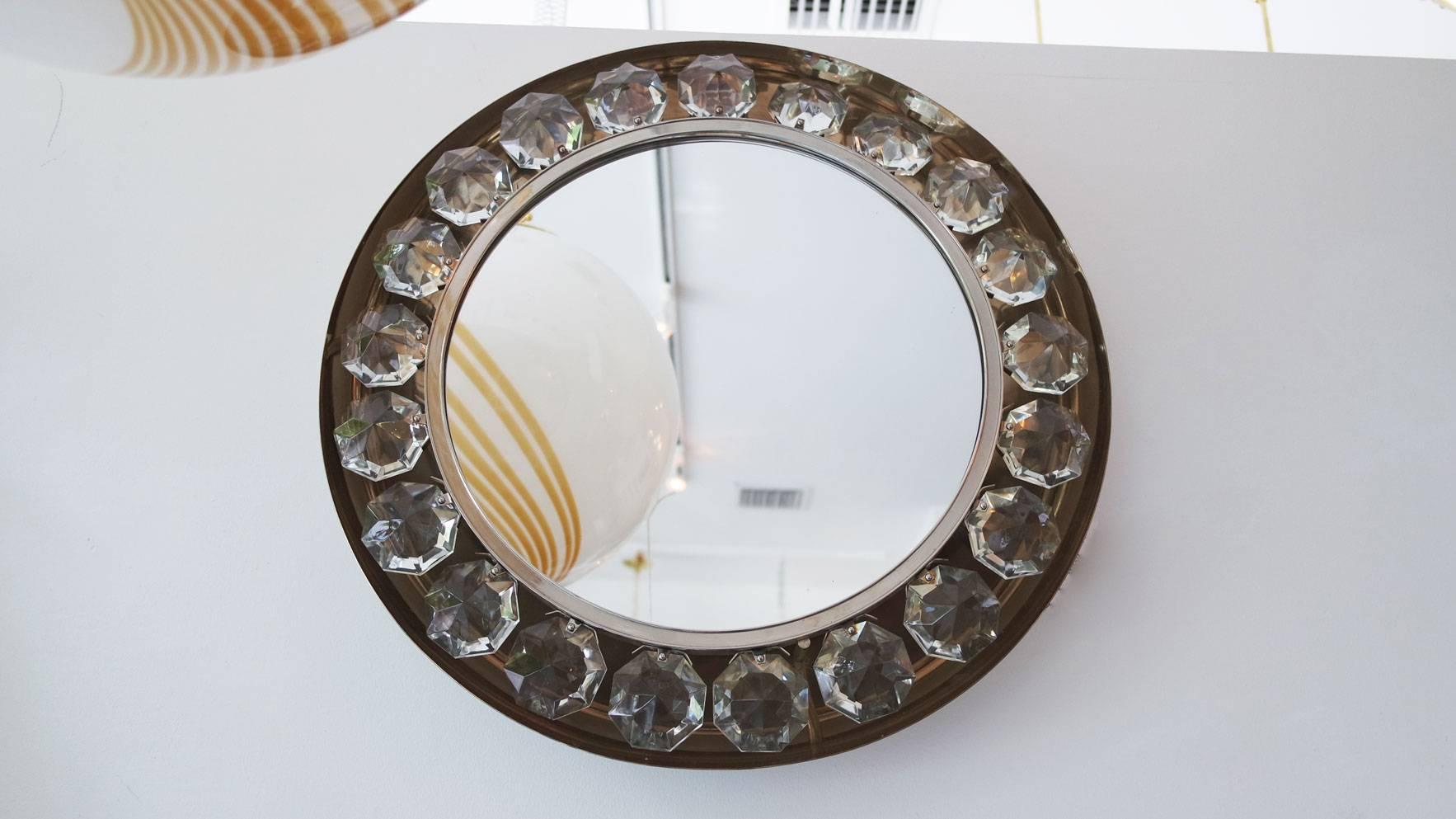 Vintage round nickel mirror with jewel element surround by Firma Jochmann.