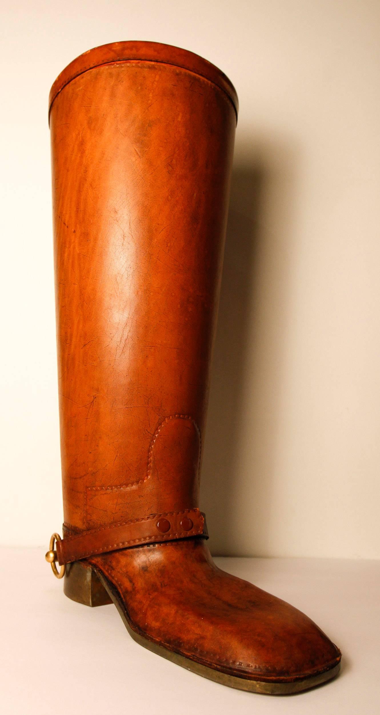 Large equestrian boot may be used as cane holder or umbrella stand. It is in the style of Gucci.
