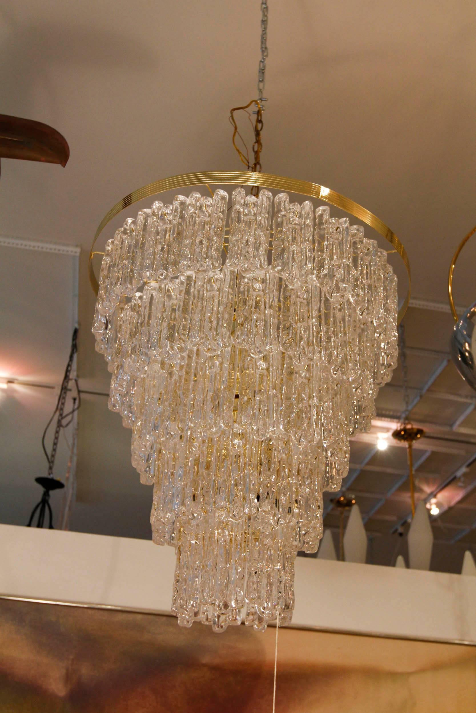 Vintage multi-tier acrylic chandelier with heavily textured panels, sculpted to look like ice.