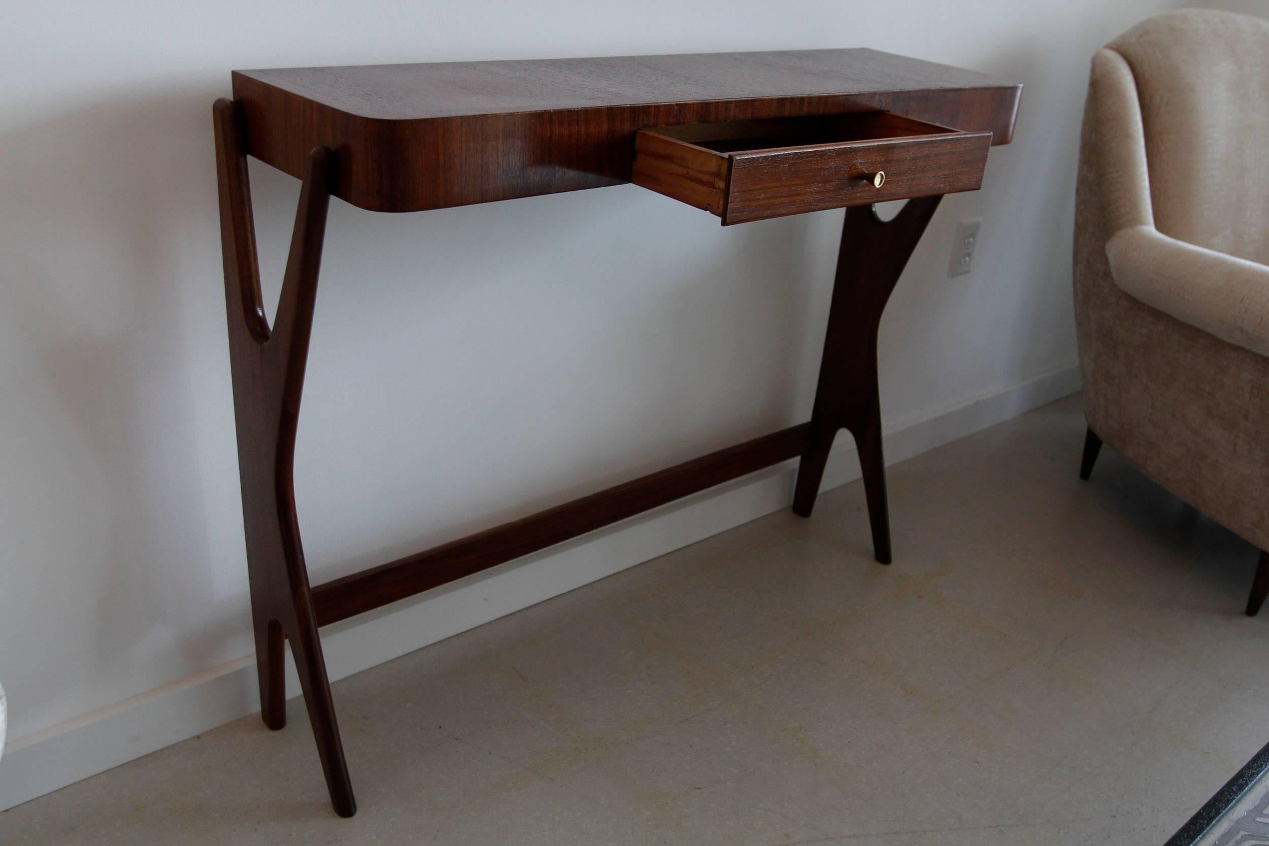 Mid-Century Modern Italian free-form wood console table slim in profile with a single drawer.