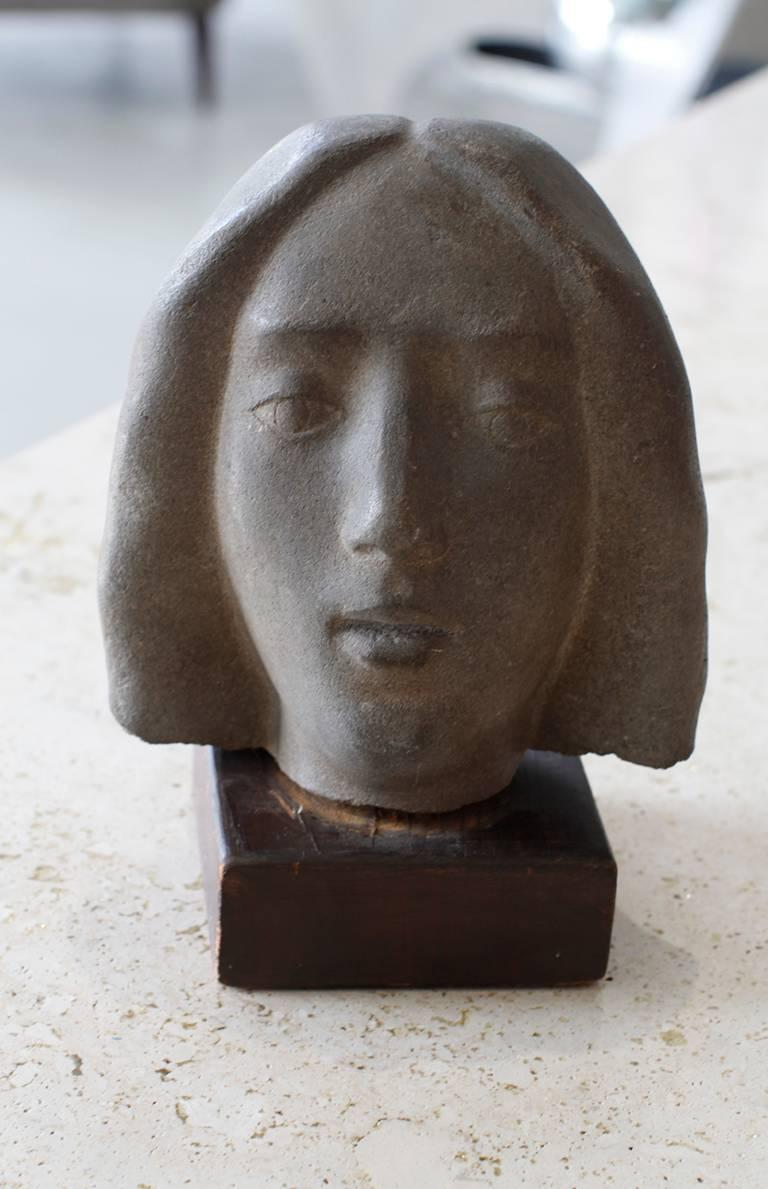 Carved Art Deco woman’s head, sculpted by direct carving.