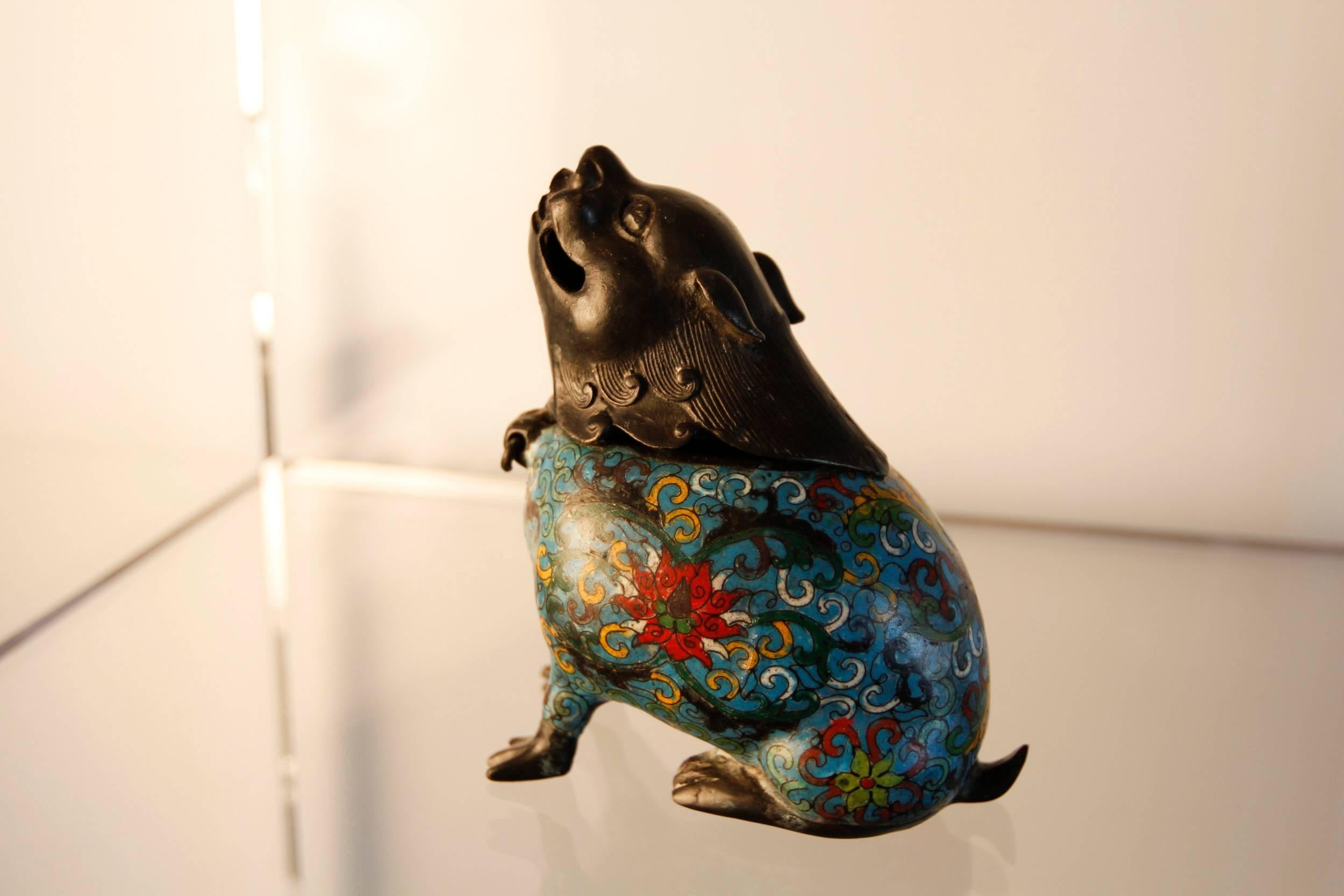 Chinese fu dog incense burner with colorful cloisonné body.