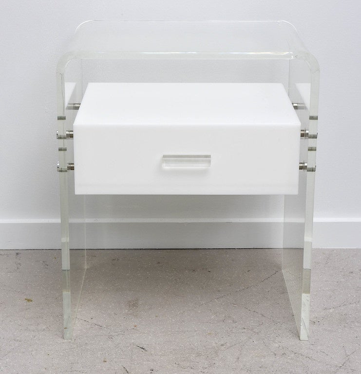 Vintage acrylic clear and white bedside chest with single drawer and chrome hardware.