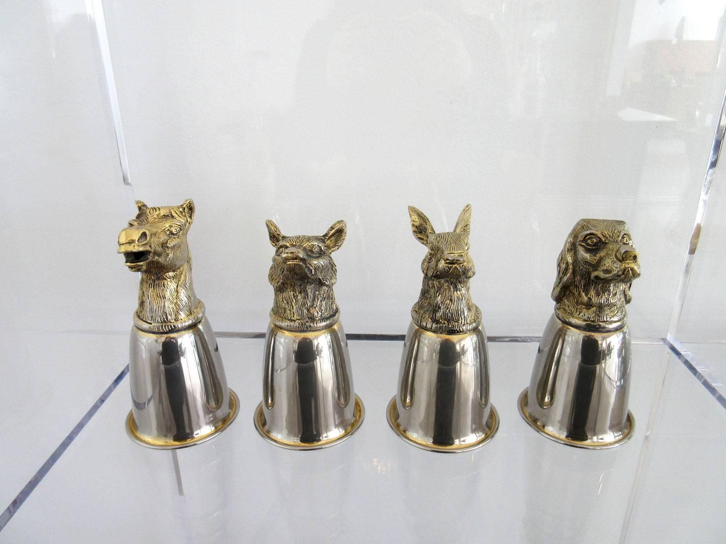 Vintage set of four Gucci stirrup cups a horse, hare, fox and dog. The cups are each individually signed and are made of brass and silver plate.