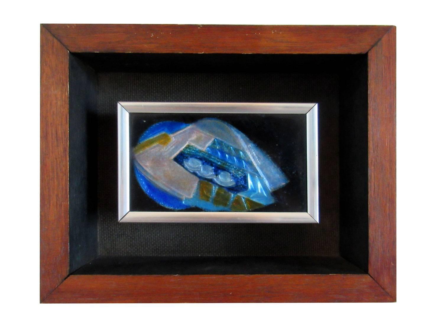 Two individually priced enamel on copper pieces by listed enamellist John Puskas. Both of them are floated within a thick wooden frame, and are signed on the back.