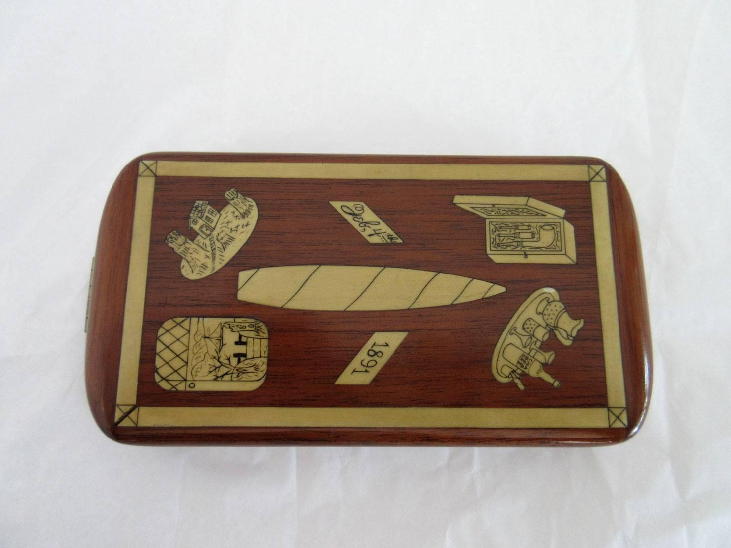 Vintage French Art Deco cigarette case with various toiletrie motifs on both sides. It is inlaid wood. This case features the original fabric.