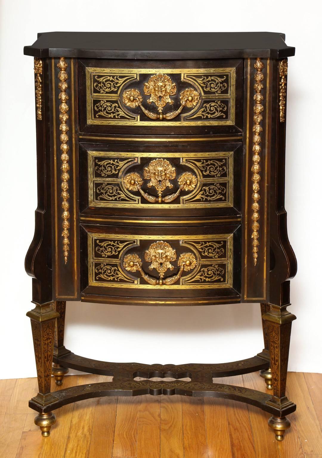 An imposing pair of Louis XIV style marble-top cabinets on stand. The front of the cabinets with three brass inlaid boulle work frieze drawers mounted with gilt bronze grotesque keyhole escutcheons behind acanthus clad handles. The sides mounted