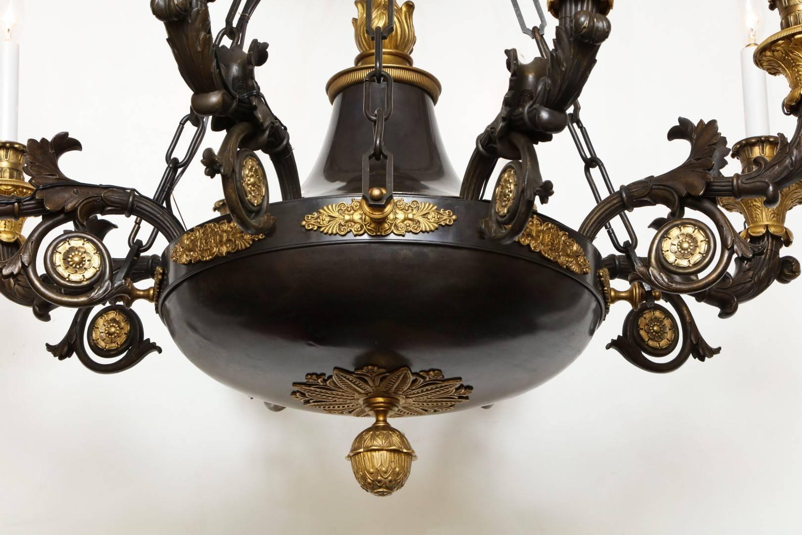 Gilt A French Empire Patinated Bronze and Gold Doré Eight-Light Chandelier