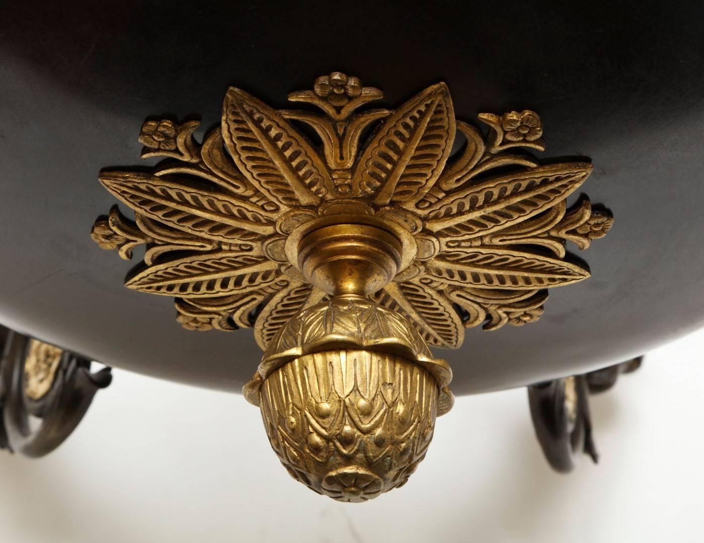 A French Empire Patinated Bronze and Gold Doré Eight-Light Chandelier 2