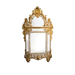 A Large French Regence-Period Carved Giltwood Mirror