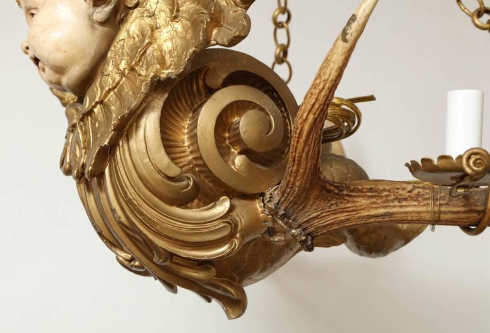An Austrian Four-Light Chandelier with Winged Cherub In Excellent Condition In New York, NY