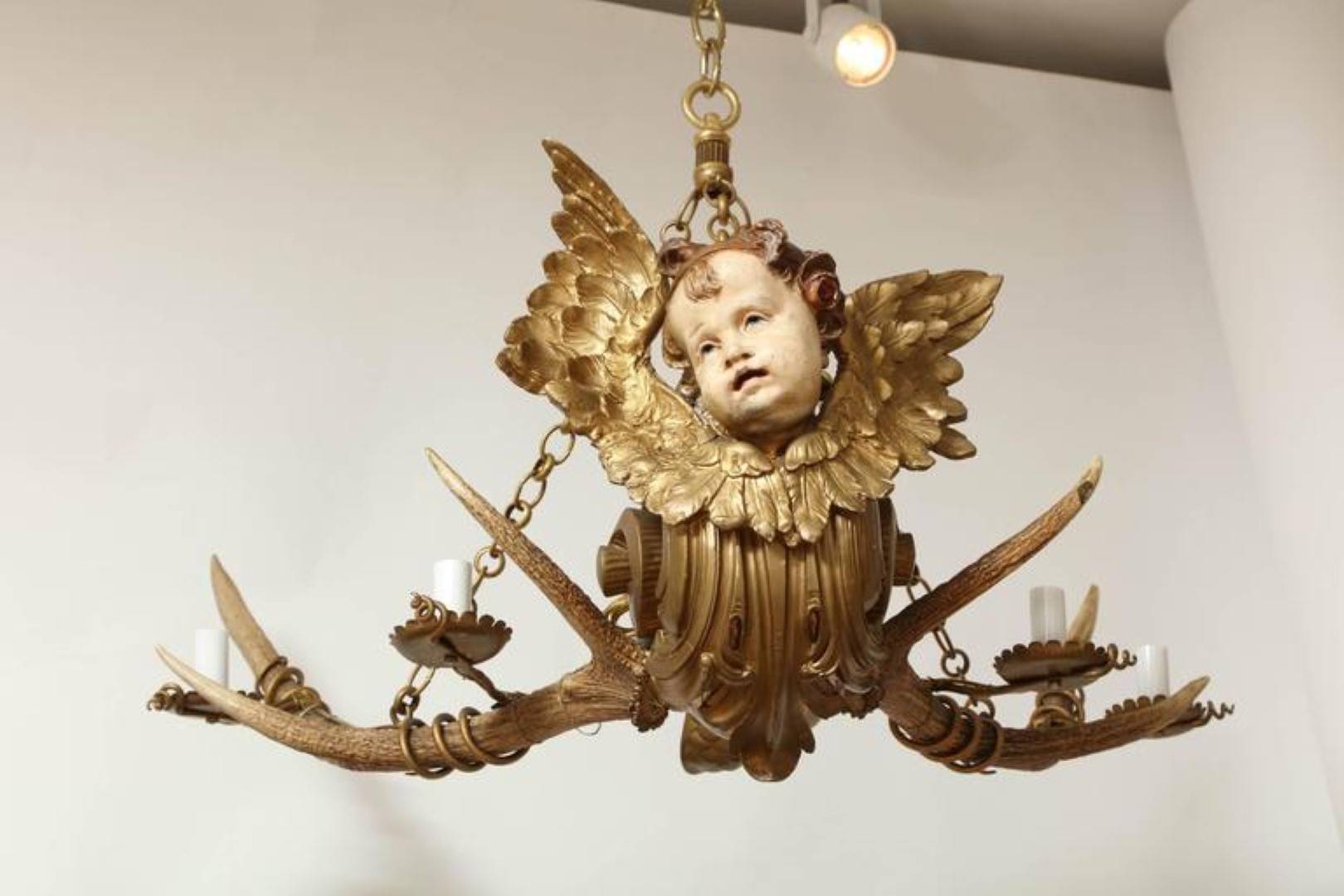Late 19th Century An Austrian Four-Light Chandelier with Winged Cherub