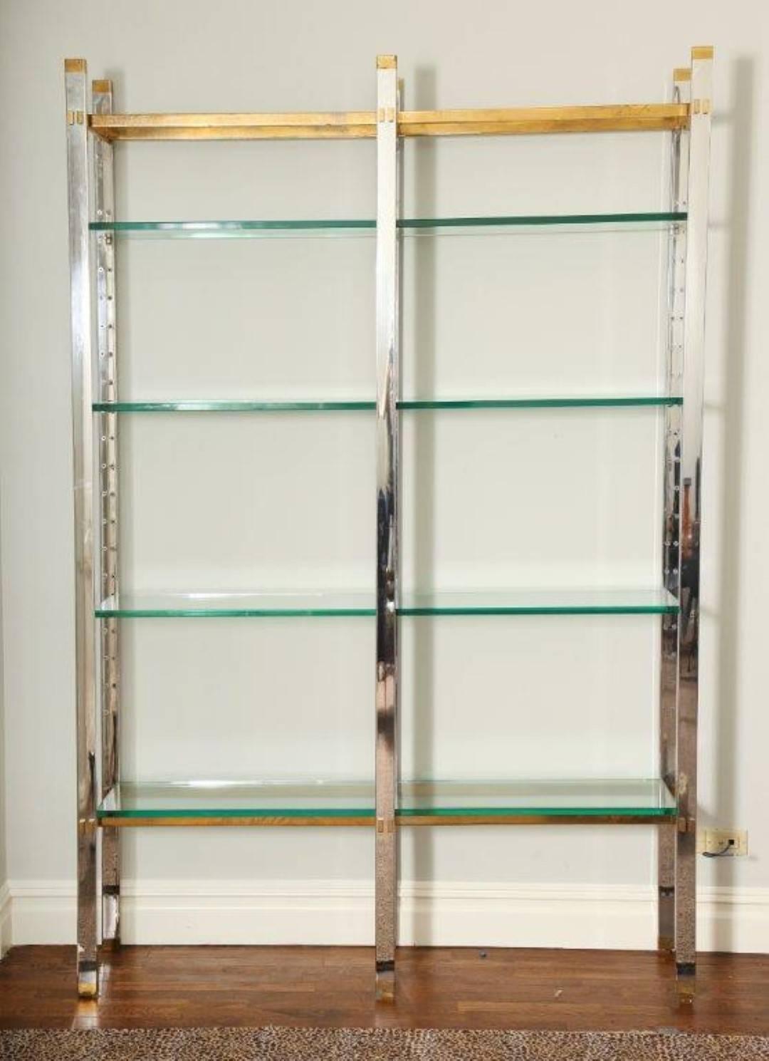 A large contemporary design chrome and polished brass four-tier etagere, the vertical frame supporting horizontal glass shelves. Custom-made by Karl Springer for an apartment at River House in New York City. Circa 1960s. 